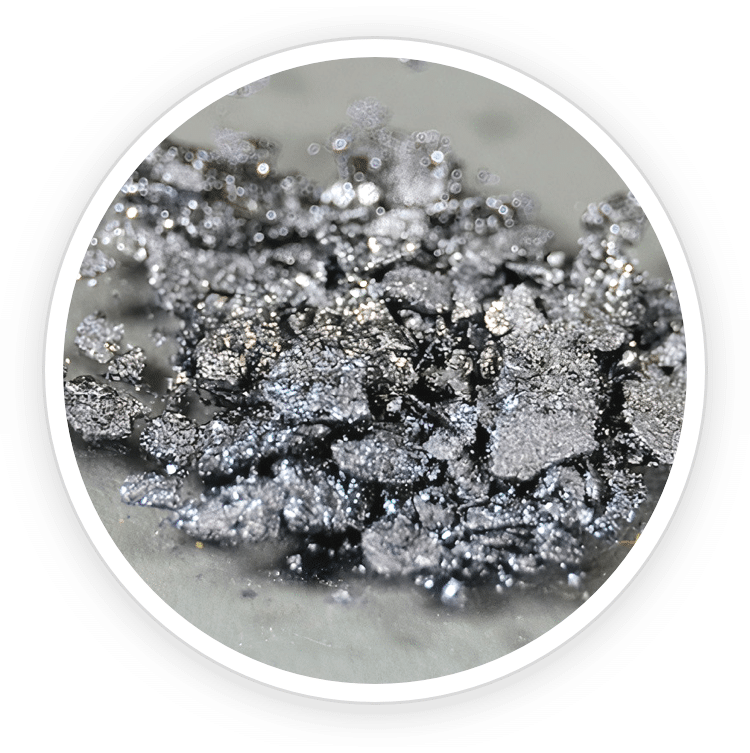 A circular close-up image of dark, shiny mineral iodine crystals, featured as a key mineral ingredient in Prostadine drops.